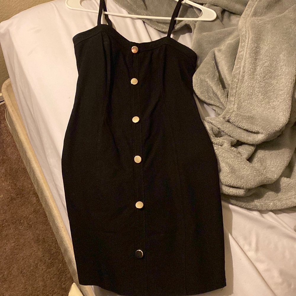 Tight black dress with buttons